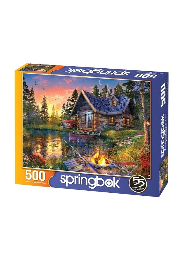 Springbok Sun Kissed Cabin 500 Piece Jigsaw Puzzle for Adults Features a Fishing Cabin by The Lake in a Colorful Illustration - Image 1