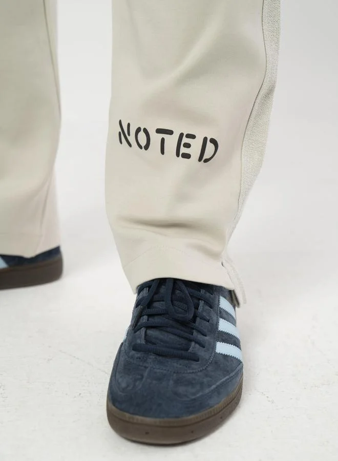 Take Two Beige Relaxed Fit Logo Print Joggers By Noted