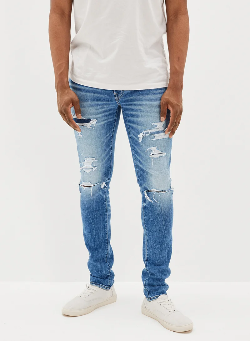 American Eagle Airflex+ Patched Slim Fit Mid Wash Jeans