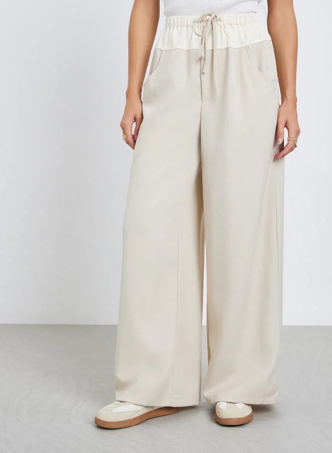 تايك تو بنطال بأرجل واسعة