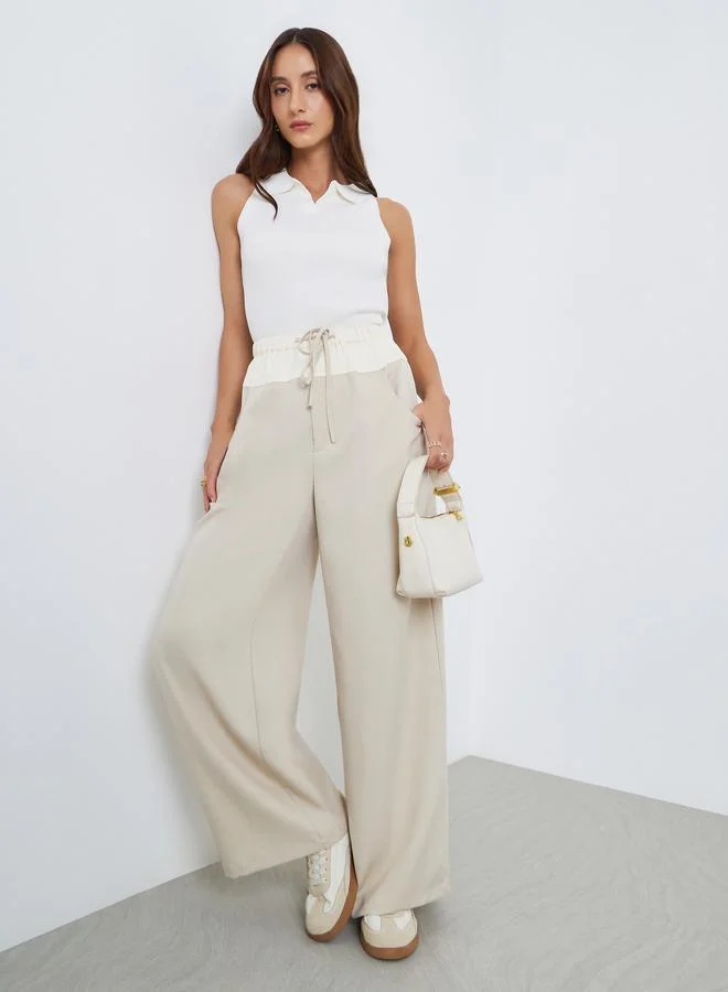 تايك تو بنطال بأرجل واسعة