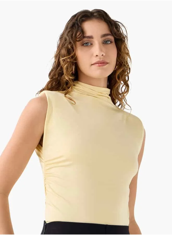 ايكونيك Iconic Relaxed Fit Sleeveless Top with Turtle Neck
