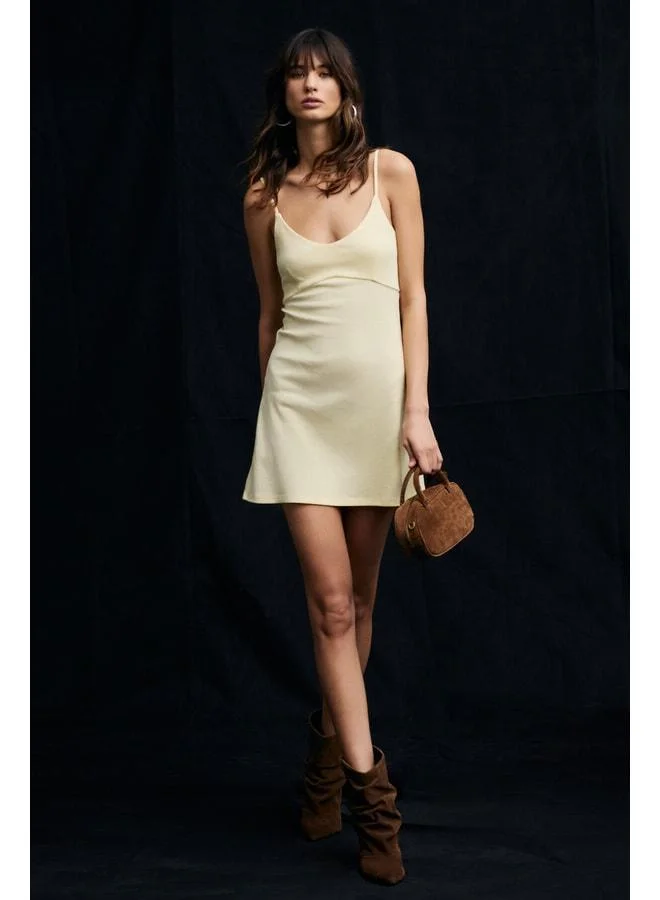 Grimelange UFRENDA Women's Soft and Stretch Fabric Backless Strappy Mini Yellow Dress.