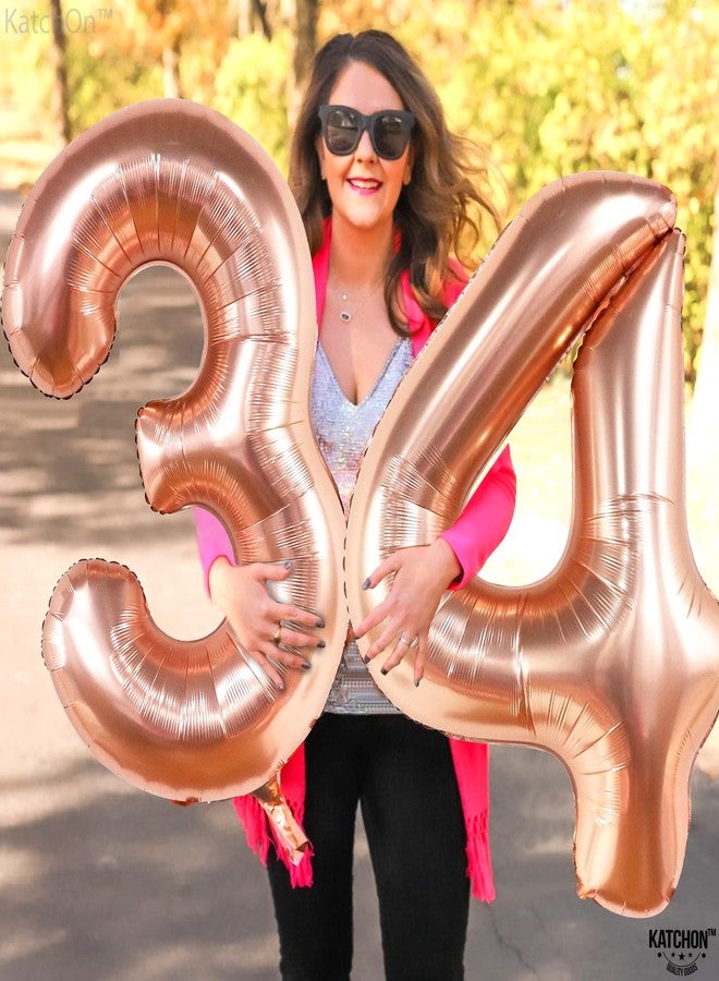 كاتشون، بالونات عملاقة ذهبية وردية اللون على شكل الرقم 34 - 40 بوصة | زينة عيد ميلاد رقم 34 للنساء | بالونات ذهبية وردية اللون على شكل الرقم 34 | مجموعة بالونات على شكل الرقم 34 لتزيين حفلات الذكرى السنوية | زينة عيد ميلاد ذهبية وردية اللون - Image 3