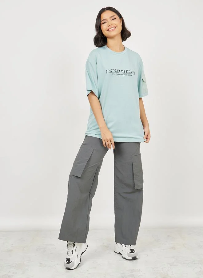Styli Pocket Detail Sleeves Find Your Place In The World Slogan Print T-shirt