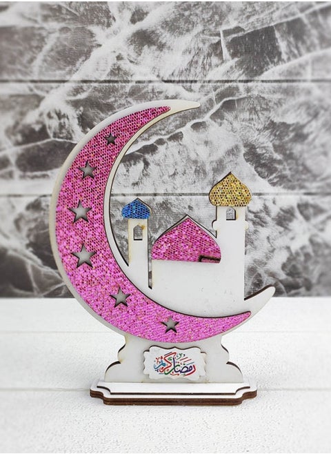 Handmade decorations made of wood with a Ramadan moon design containing the phrase Ramadan Kareem