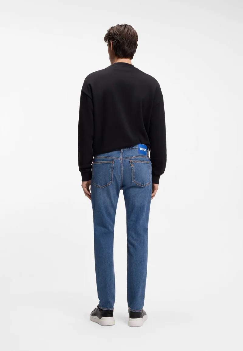 هوجو جينز سكيني بقصة ضيقة من قماش الدينم المطاطي باللون الأزرق المتوسط