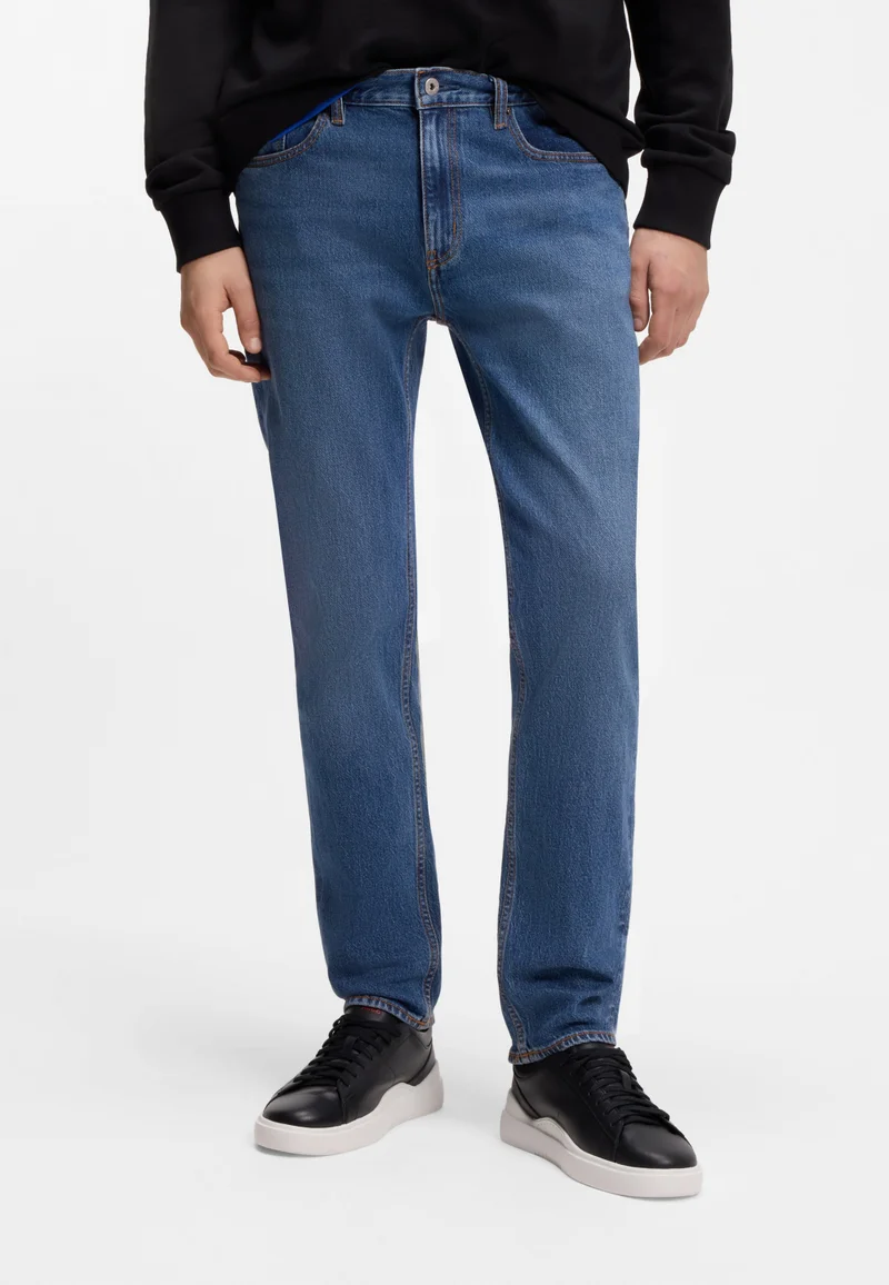 هوجو جينز سكيني بقصة ضيقة من قماش الدينم المطاطي باللون الأزرق المتوسط