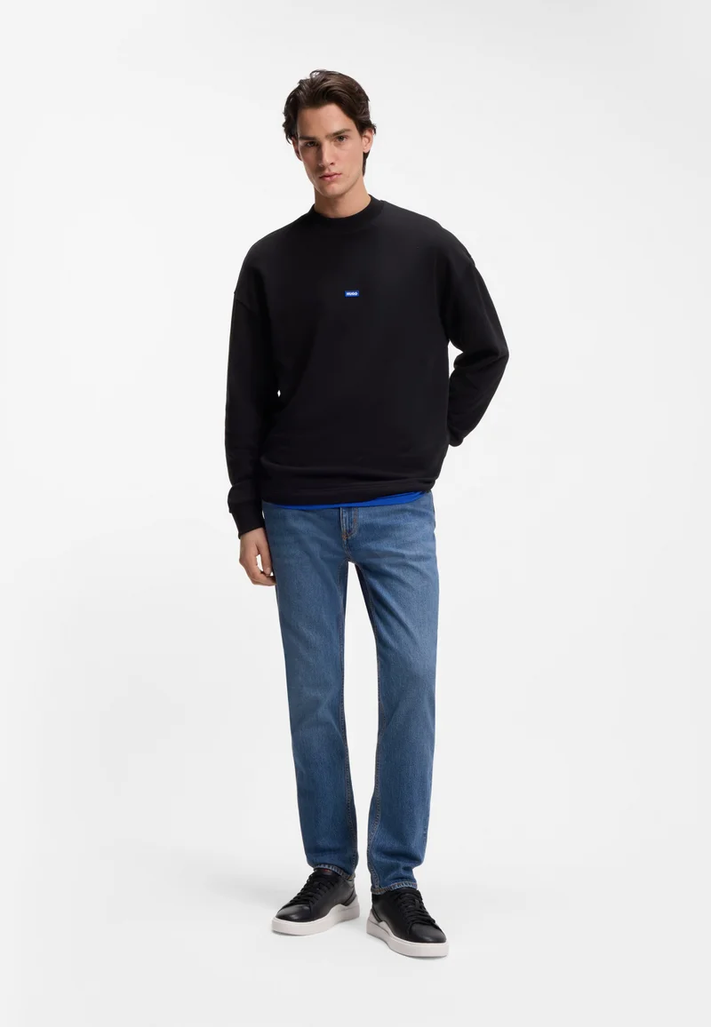 HUGO Dark Blue Slim-fit jeans in mid-blue stretch denim for Men | Best Price UAE