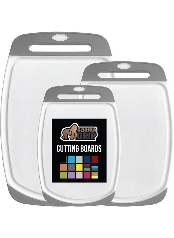 GORILLA GRIP 100% BPA-Free Reversible Kitchen Cutting Board Set of 3, Nonporous, Juice Grooves to Catch Liquid, Slip Resistant Handle Border, Dishwasher Safe, Durable Large Food Chopping Boards, Gray - Image 1