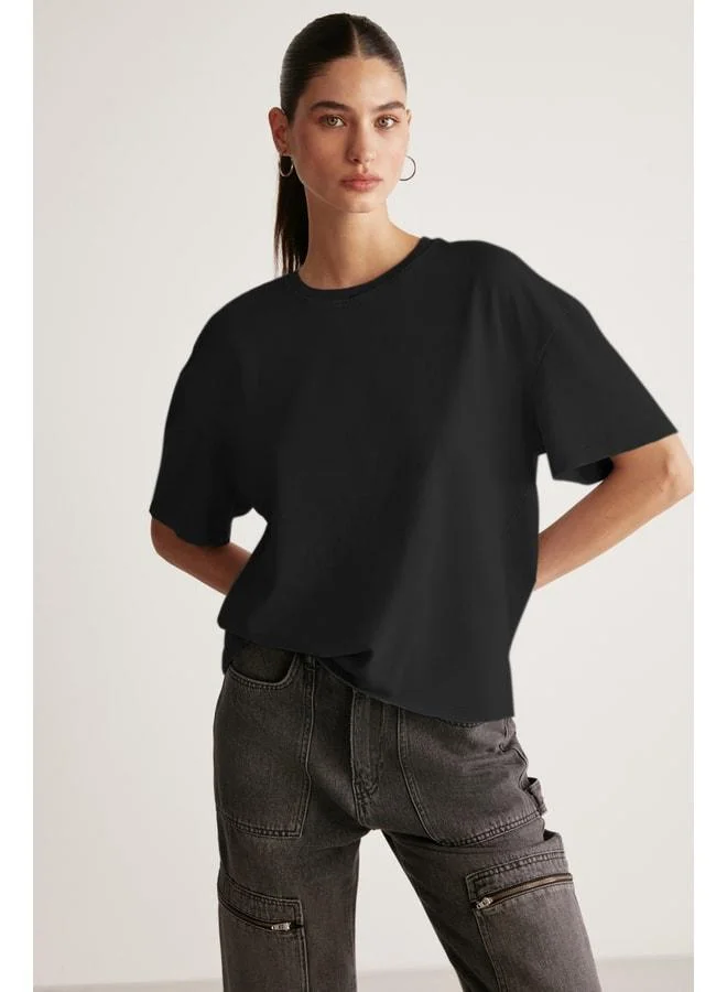 Grimelange Jemmy Women's 100% Organic Cotton Relaxed Fit Slit Round Neck Black T‑shirt.