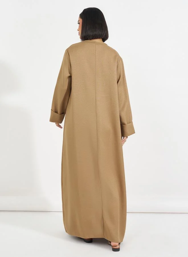 ستايلي عباية تويد طويلة مزينة بأزرار