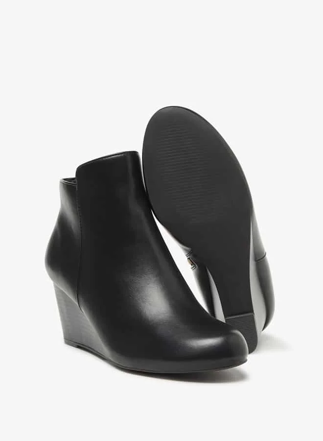فلورا بيلا من شو إكسبرس Women Solid Ankle Boots with Zip Closure and Wedge Heels