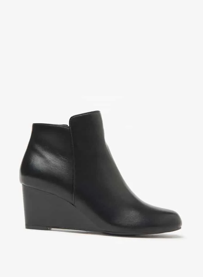 فلورا بيلا من شو إكسبرس Women Solid Ankle Boots with Zip Closure and Wedge Heels
