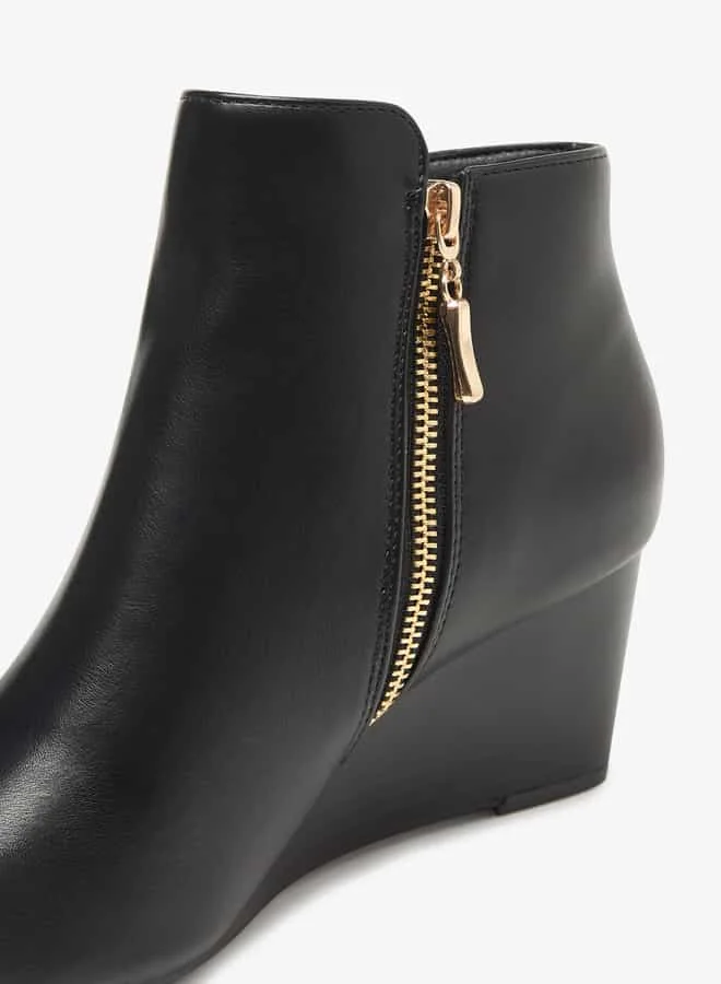فلورا بيلا من شو إكسبرس Women Solid Ankle Boots with Zip Closure and Wedge Heels