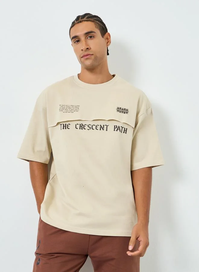 Styli Men Beige Graphic Print Oversized T-Shirt