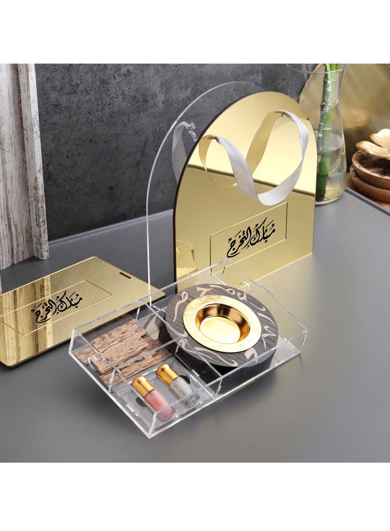 Story Of Candle An Incense Burner with Distinctive Arabic Engravings, a Luxurious Bag Made of White and Transparent Acrylic, a Box Containing Natural Oud Chips, and two Packages of a Quarter Tola of Luxurious Musk. - Image 1