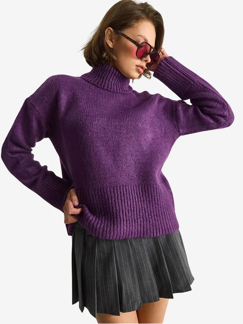 بيانكو لوتشي بلوفر بياقة عالية محبوك كبير الحجم من لوتشي