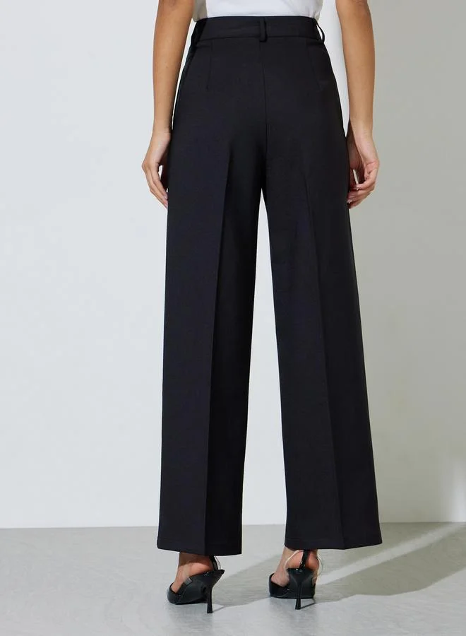 Styli  Black Solid Tailored Wide-Leg Trousers for Women | Best Price UAE