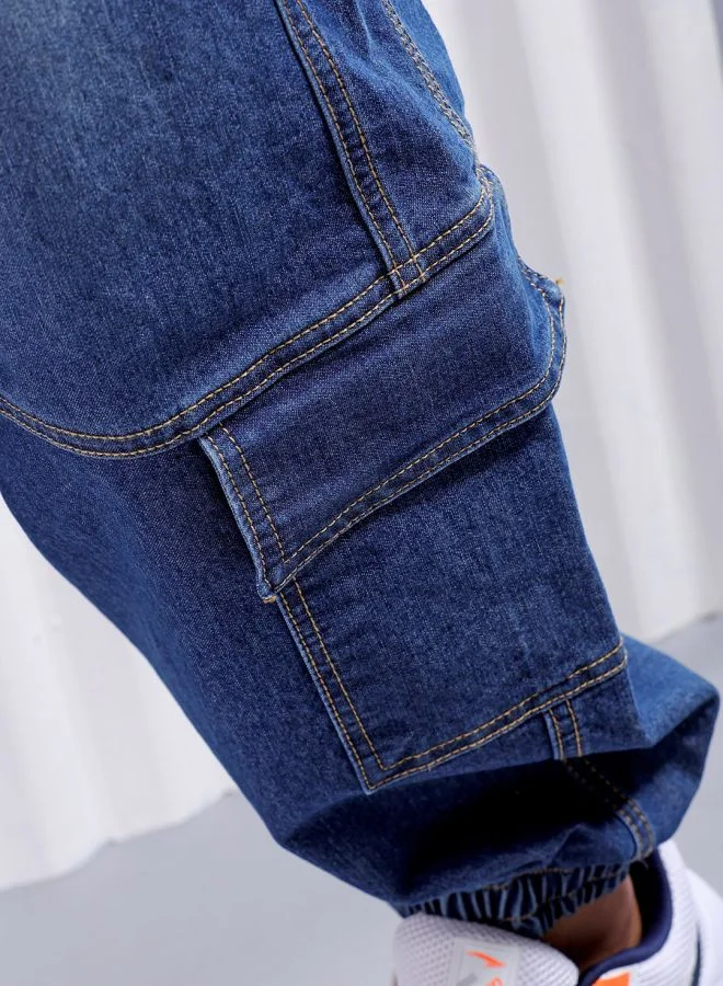 شركة المرآب الهندية Men Loose Fit Solid Mid-Rise Stretchable Denim Joggers