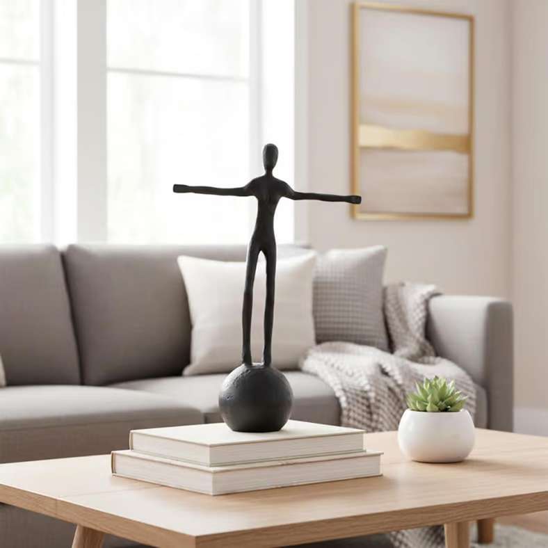 Pan Home Black Metal Man Standing On Sphere Sculpture - Image 1