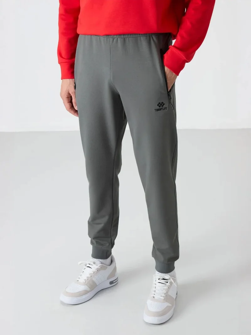 تومي لايف TOMMY Men's Solid Pull-on Sweatpants With Zip Pocket