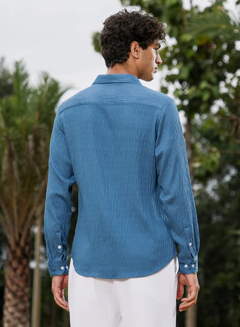 Campus Sutra Campus Sutra Men Solid Creased-Tactile Shirt | Spread Collar Long Cuffed Sleeves | Button Closure Curved Hem | Solid Creased | Woven Fabric For Casual & Daily Wear | Ocean Blue
