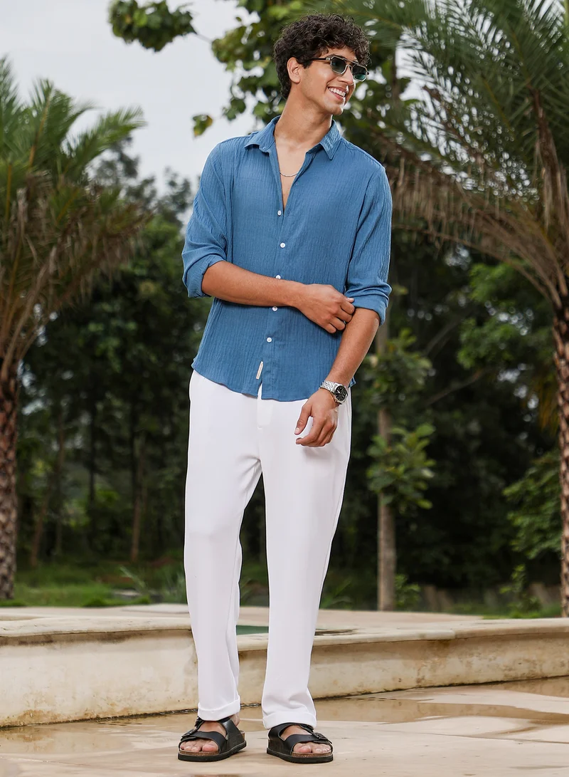 Campus Sutra Campus Sutra Men Solid Creased-Tactile Shirt | Spread Collar Long Cuffed Sleeves | Button Closure Curved Hem | Solid Creased | Woven Fabric For Casual & Daily Wear | Ocean Blue