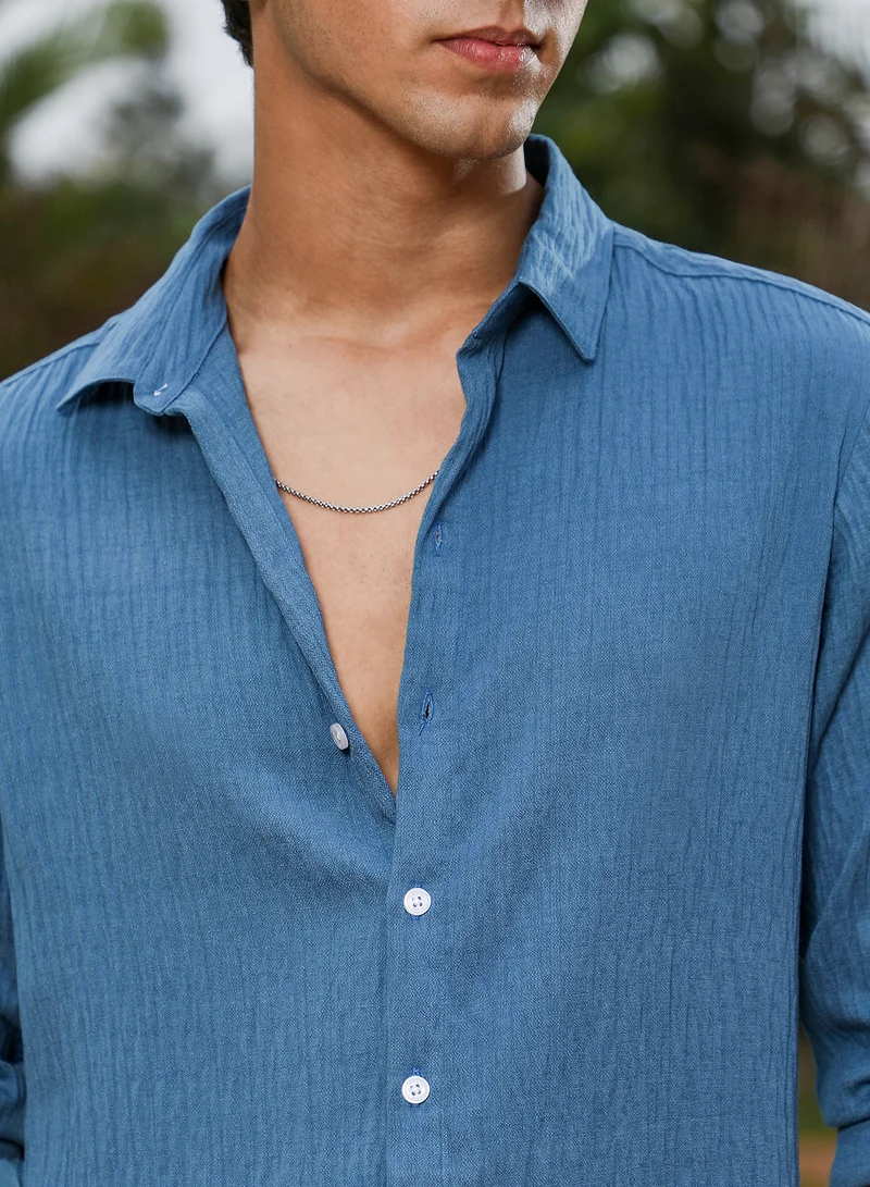 Campus Sutra Campus Sutra Men Solid Creased-Tactile Shirt | Spread Collar Long Cuffed Sleeves | Button Closure Curved Hem | Solid Creased | Woven Fabric For Casual & Daily Wear | Ocean Blue