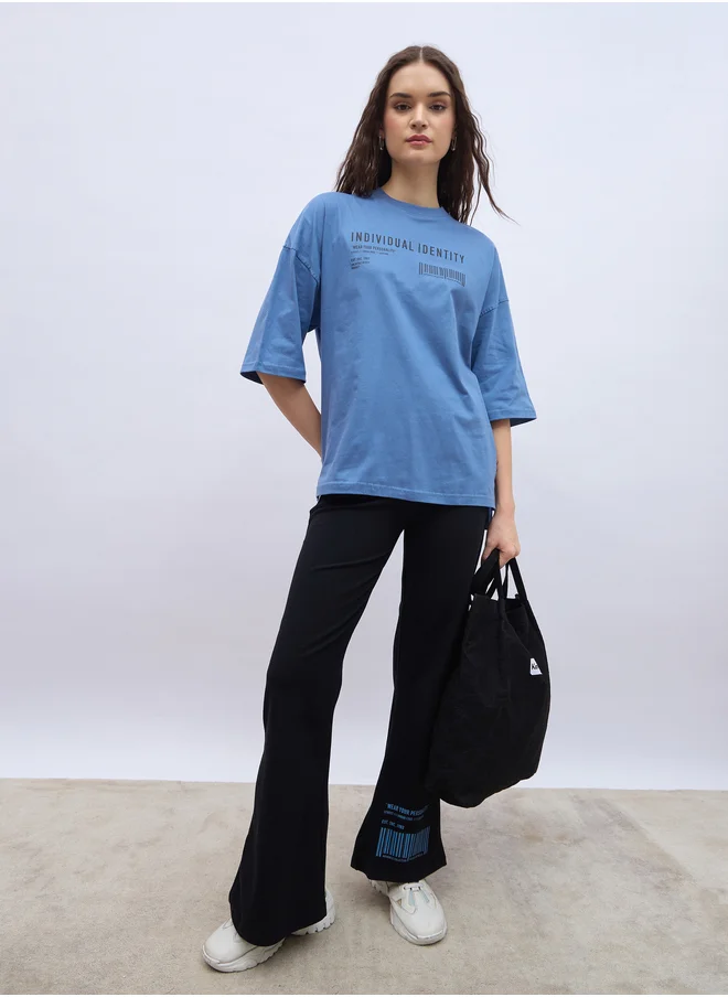 ستايلي Slogan Print Oversized T-Shirt and Flared Leggings Co-Ords