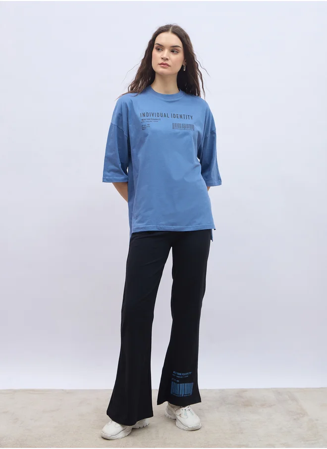 ستايلي Slogan Print Oversized T-Shirt and Flared Leggings Co-Ords