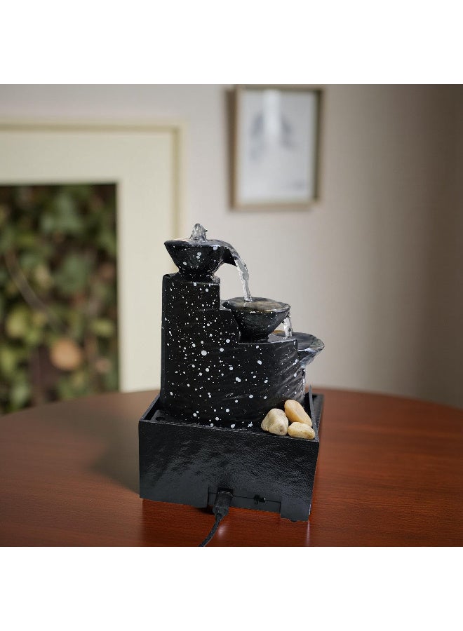 A tabletop fountain and waterfall with LED lighting and natural river stones. Battery operated. - Image 1