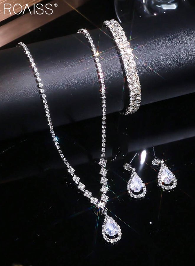 رويس مجموعة مجوهرات أنيقة مكونة من 4 قطع من القلائد والأساور، مجموعة مجوهرات زفاف من الكريستال اللامع، قلادة فضية أنيقة مرصعة بأحجار الراين، أقراط متدلية من الكريستال على شكل دمعة، مجموعات مجوهرات تنكرية لحفلات الزفاف وحفلات التخرج - Image 3
