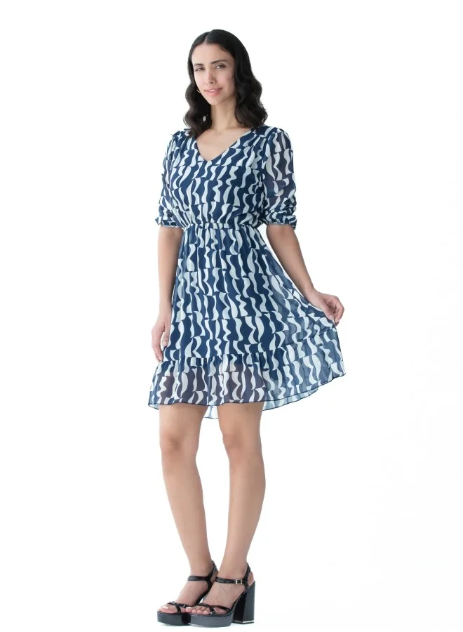 زابايوني This elegant dress features a unique blue pattern, perfect for casual and formal occasions.