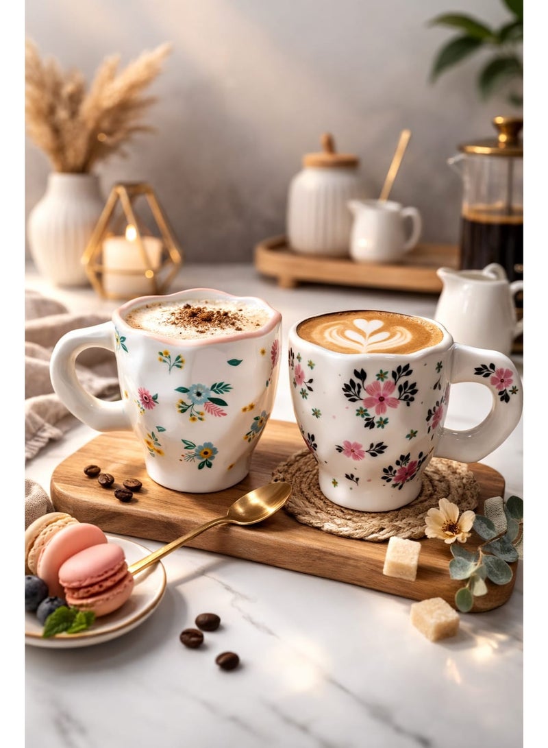 Set of 2 artistic ceramic cups with soft floral and bird designs in a pastel touch on a white background, 300ml capacity per cup, ideal for coffee, latte, or tea with a comfortable handle and elegant design. - Image 3