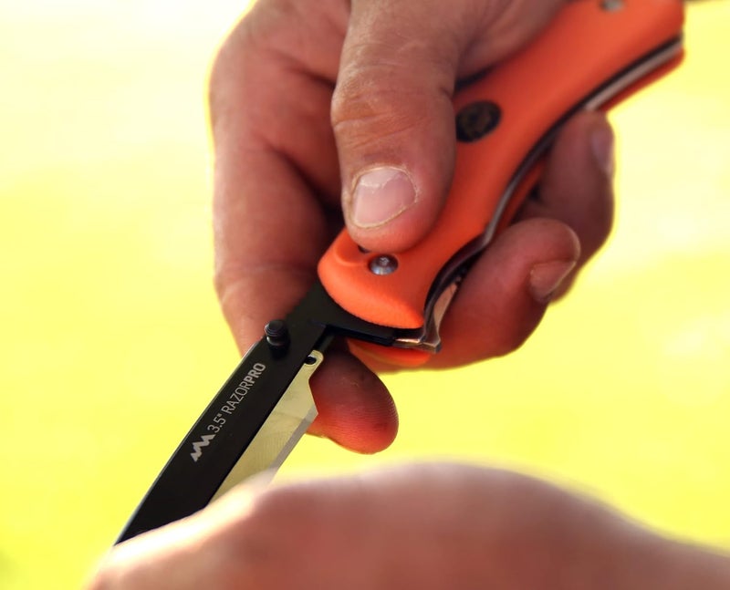 Outdoor Edge RazorPro G Double Blade Hunting Knife – Replaceable Razor Sharp Skinning Blade & Gutting Knife for Fast Field Dressing, Non-Slip Black Handle, Black Sheath with 6 Extra Blades (Orange) - Image 5