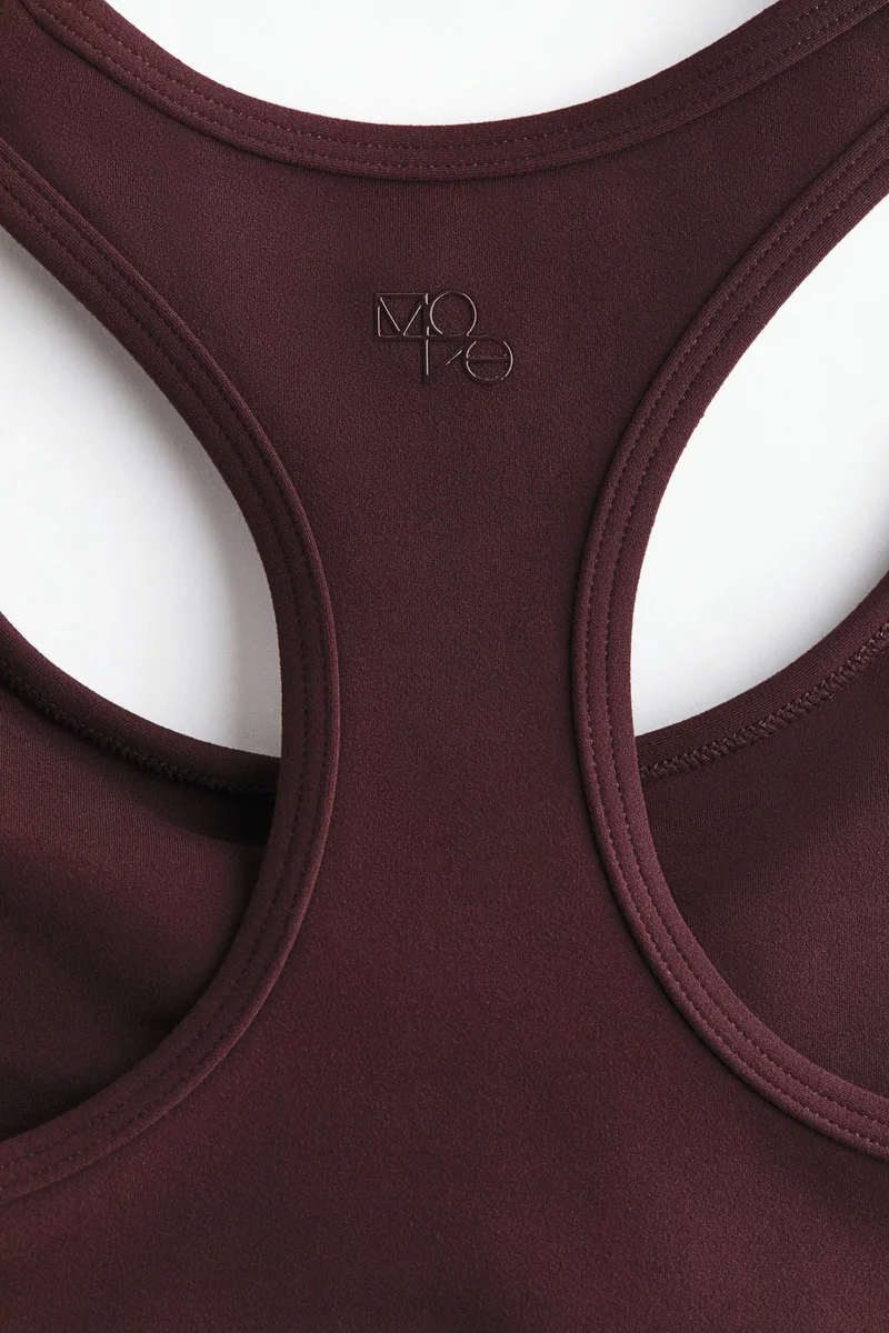 اتش اند ام حمالة صدر رياضية متوسطة الدعم من نسيج سوفت موف