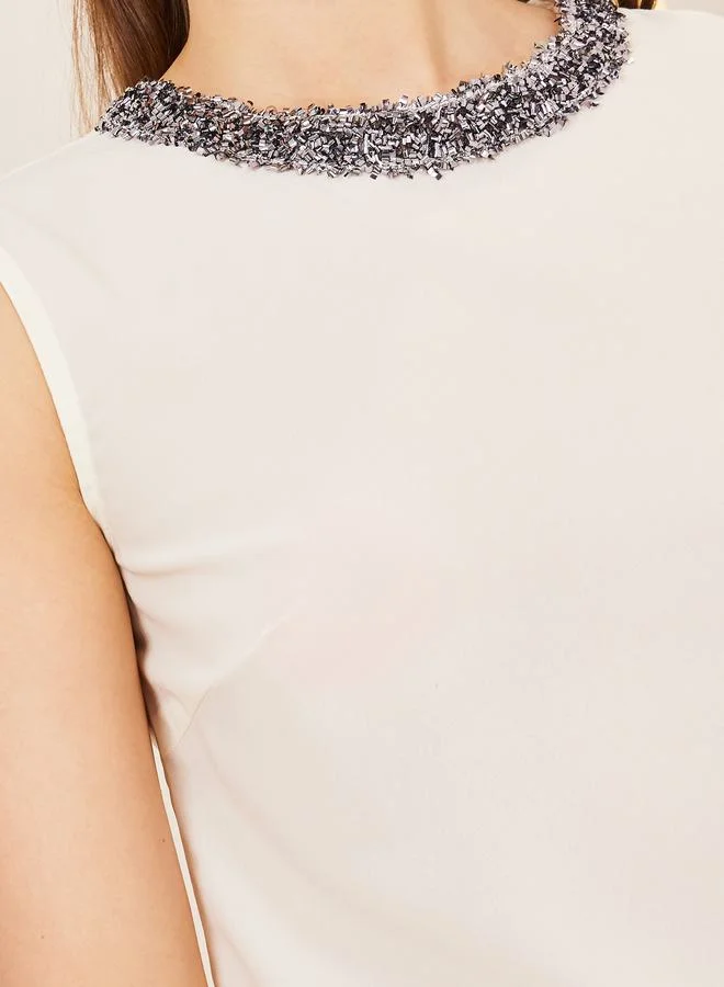 ستايلي Embellished Neck High Low Hem Blouse