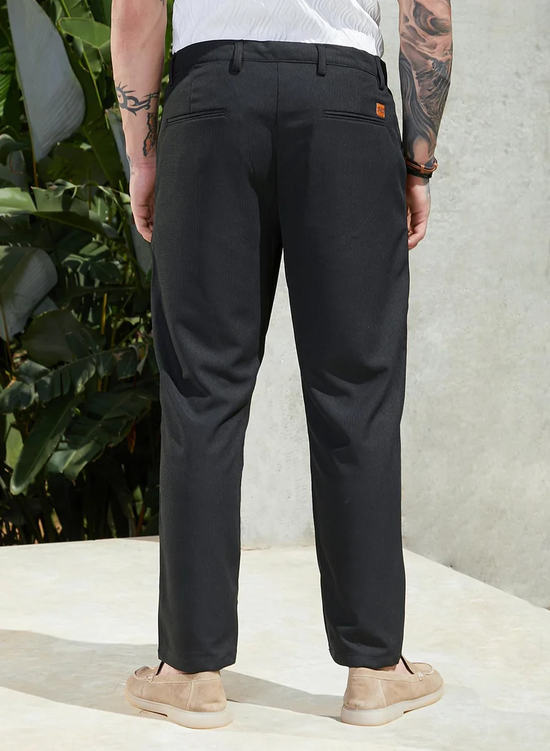 Campus Sutra Black Men's Midnight Black Tactile-Pleated Chino Trousers for Men | Best Price UAE