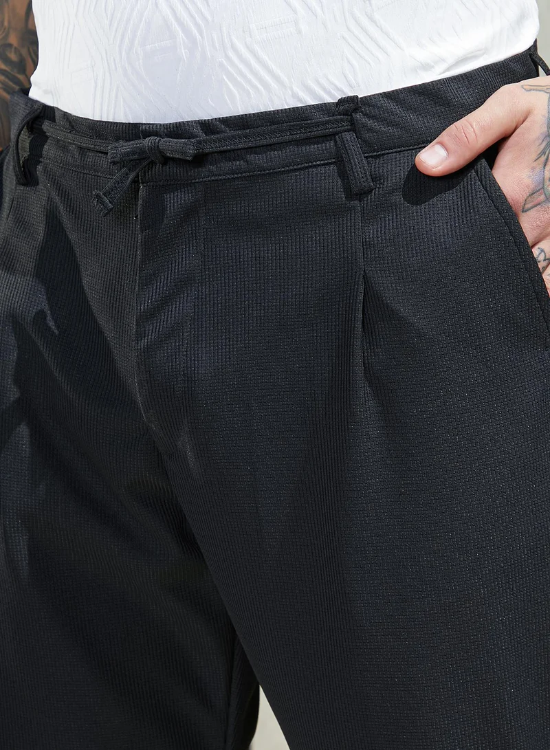 Campus Sutra Black Men's Midnight Black Tactile-Pleated Chino Trousers for Men | Best Price UAE