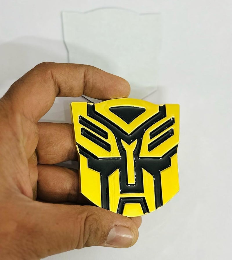AUTO MT Emblems for Car & Bike Metal Lo.go and Grill Me.tal Lo.go, Auto Accessories for Car Emblem 3D Badge Auto Racing Sport Sticker Grand Tourer Decal. (Small Golden Black TRANSFORMERR Logo) - Image 1