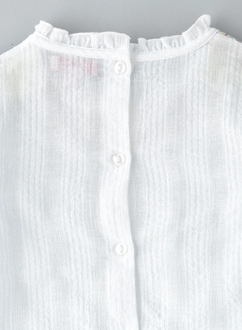 Jelliene Woven top with embroidery at neck