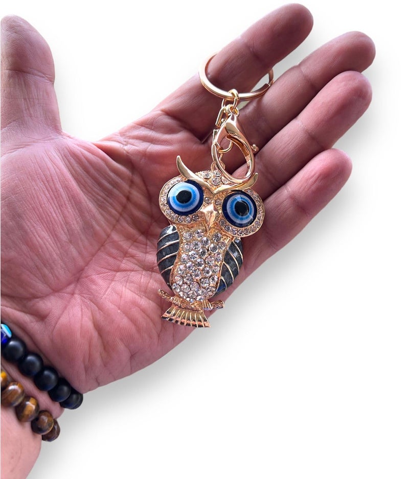 BLUE BEADS Gold with Evil Eye Crystal Rhinestone Sparkling Owl Keychain For Bike/Car Gifting Key Ring For Men Women and Handbag Charm (Black) - Image 1