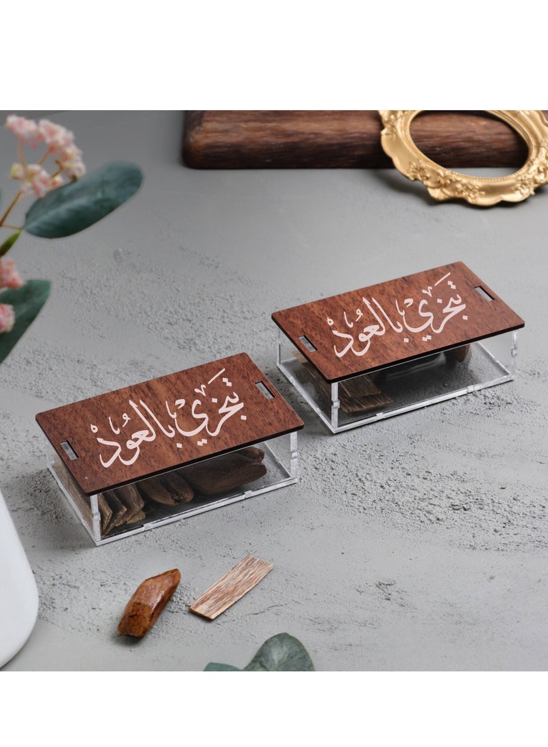 Story Of Candle Maruki Incense Oud and Vietnamese Oud Flakes come in two multi-use transparent storage containers bearing an Arabic phrase  - Image 1