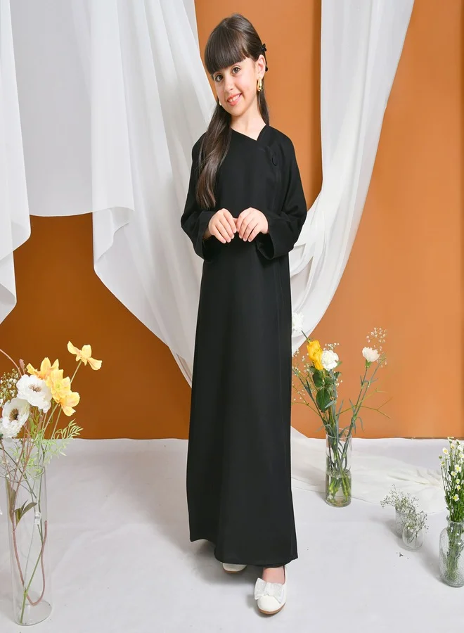 HAWRAA ABAYA Viola Abaya | Black, practical, elegant, with a side button closure