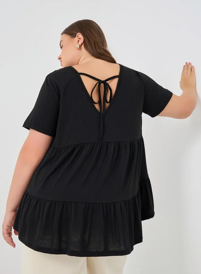 Styli Styli Plus Size Solid Tiered Back T-Shirt with Tie Detail