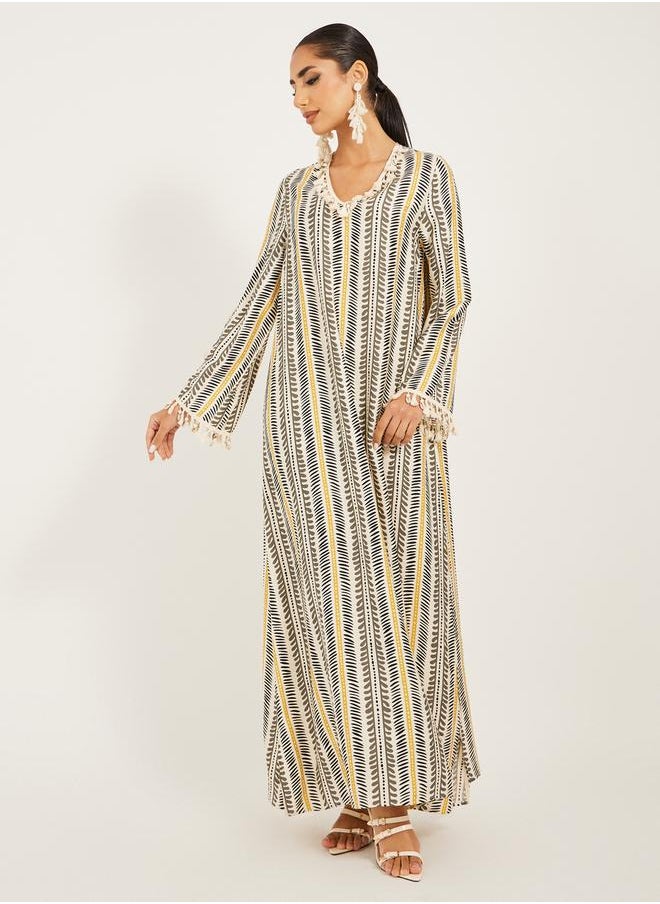 Styli - stripe pattern print A line jalabiya w/ shell tassel trim at neck and sleeve hem - Image 1