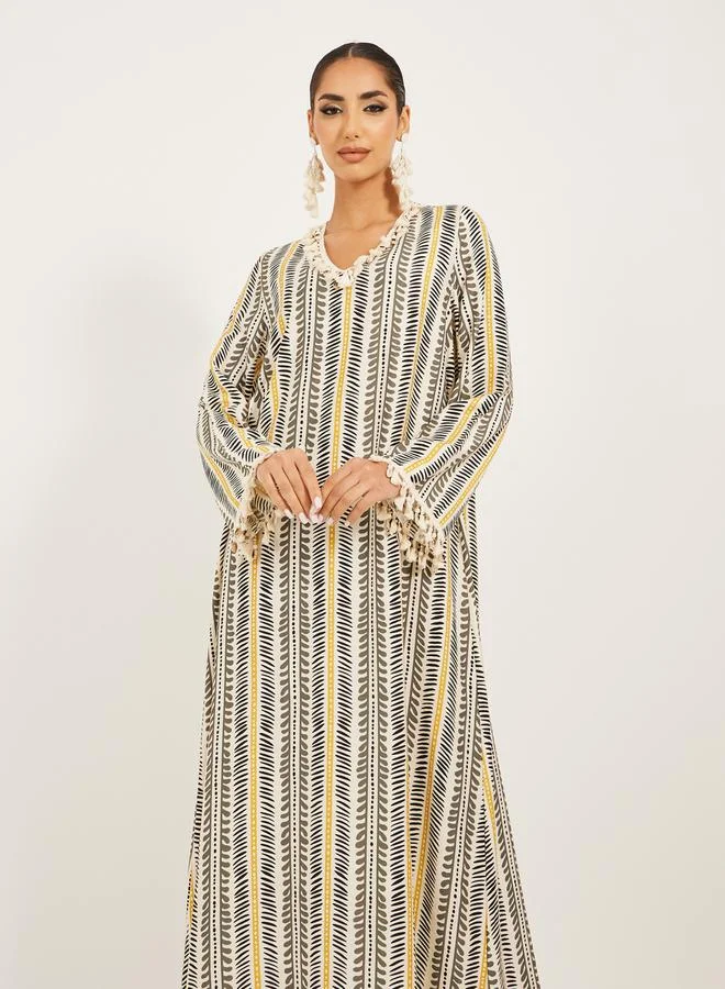ستايلي stripe pattern print A line jalabiya w/ shell tassel trim at neck and sleeve hem