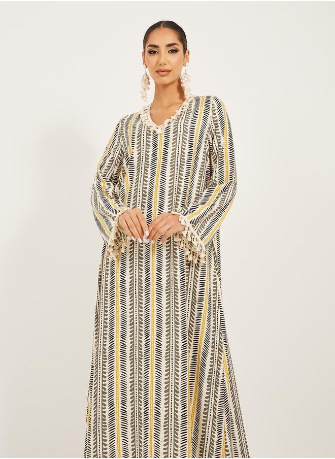 Styli - stripe pattern print A line jalabiya w/ shell tassel trim at neck and sleeve hem - Image 1