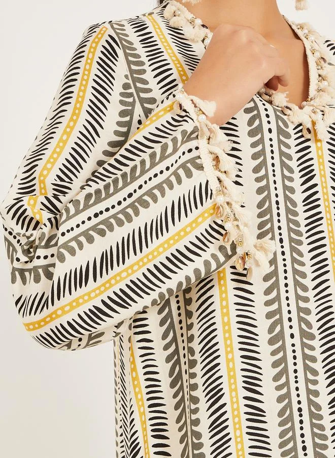 ستايلي stripe pattern print A line jalabiya w/ shell tassel trim at neck and sleeve hem